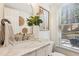 Elegant powder room with marble countertop, modern fixtures, and natural light for a spa-like experience at 2110 Laurel Mill Way, Roswell, GA 30076