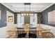 Charming dining room with modern lighting fixture and elegant decor, perfect for Gathering gatherings and entertaining guests at 2110 Laurel Mill Way, Roswell, GA 30076