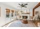 Comfortable living room features a fireplace and double doors at 2110 Laurel Mill Way, Roswell, GA 30076