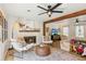 Inviting living room featuring a fireplace, comfortable seating, and stylish decor at 2110 Laurel Mill Way, Roswell, GA 30076