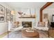 Fireplace and seating in a bright and airy living room at 2110 Laurel Mill Way, Roswell, GA 30076