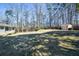 Spacious backyard with shed and mature trees provides plenty of room for activities at 4205 S Hurt Sw Rd, Smyrna, GA 30082