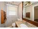 Bathroom featuring a granite countertop, sink, mirror, and custom wall paper at 4205 S Hurt Sw Rd, Smyrna, GA 30082