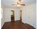 Bedroom with ensuite bathroom, hardwood floors, ceiling fan, and closet at 4205 S Hurt Sw Rd, Smyrna, GA 30082