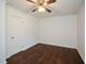 Bedroom featuring hardwood floors, ceiling fan, a window and a closet at 4205 S Hurt Sw Rd, Smyrna, GA 30082