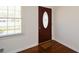 Entryway featuring a decorative front door, hardwood floors, and natural light at 4205 S Hurt Sw Rd, Smyrna, GA 30082