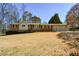 Charming single-story home featuring a brick facade, landscaped yard, and attached two-car garage at 4205 S Hurt Sw Rd, Smyrna, GA 30082