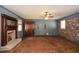Spacious living room featuring a cozy fireplace, wood-look floors and large windows at 4205 S Hurt Sw Rd, Smyrna, GA 30082