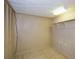 An empty bonus room with shelving and neutral walls provides ample storage space at 4205 S Hurt Sw Rd, Smyrna, GA 30082