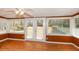 This sunroom has laminated wood floors with french doors leading to the yard at 4205 S Hurt Sw Rd, Smyrna, GA 30082