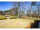 Front yard view showcasing mature trees and landscaping at 4205 S Hurt Sw Rd, Smyrna, GA 30082