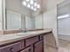 Bathroom featuring a vanity with granite countertops, a sink, and access to a shower at 426 Parkstone Dr, Woodstock, GA 30188