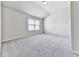 Bedroom with neutral walls, carpet, and a window for natural light at 426 Parkstone Dr, Woodstock, GA 30188