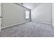 Neutral bedroom providing a cozy space with a window and carpet at 426 Parkstone Dr, Woodstock, GA 30188