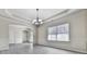 Bright dining area features wood-look floors, modern chandelier, and elegant trim at 426 Parkstone Dr, Woodstock, GA 30188