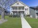 Beautiful two-story home with landscaped yard and inviting entryway at 426 Parkstone Dr, Woodstock, GA 30188