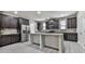 Modern kitchen with stainless steel appliances, granite countertops, and large island at 426 Parkstone Dr, Woodstock, GA 30188