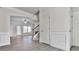 Living room with hardwood floors, a fireplace, a ceiling fan, and an open floor plan at 426 Parkstone Dr, Woodstock, GA 30188