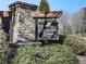 Stone entryway sign for Cornerstone Estates, set among lush greenery at 426 Parkstone Dr, Woodstock, GA 30188