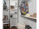 Walk-in closet with wooden floors, shelves, storage, and a variety of clothing apparel and accessories at 603 Dunbar Dr, Dunwoody, GA 30338