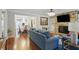 Open-concept living space with living room, dining room and stone fireplace at 603 Dunbar Dr, Dunwoody, GA 30338