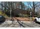 Parking spaces with electric car charging stations, surrounded by trees and landscaping at 603 Dunbar Dr, Dunwoody, GA 30338