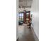 Hallway with exposed brick and concrete floors leads into a well-lit open living area at 174 Chester Se Ave # 127, Atlanta, GA 30316