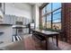 Modern kitchen with stainless steel appliances and view of the dining area at 174 Chester Se Ave # 127, Atlanta, GA 30316