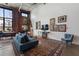 Comfortable living room with exposed brick accent wall and stylish seating at 174 Chester Se Ave # 127, Atlanta, GA 30316