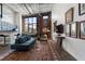 Open-concept living room with exposed brick, high ceilings, and stylish furnishings at 174 Chester Se Ave # 127, Atlanta, GA 30316