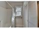 Bathroom with shower/tub combo, window, and closet with louvered doors at 2953 Hardman Ne Ct, Atlanta, GA 30305