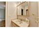 Bathroom with beige countertop, sink, decorative lighting and gold fixtures at 2953 Hardman Ne Ct, Atlanta, GA 30305