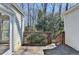 View of the wooden deck with railing and access to the house, surrounded by trees and natural landscape at 2953 Hardman Ne Ct, Atlanta, GA 30305