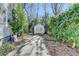 Long driveway leading to a detached garage, surrounded by mature trees and landscaping at 2953 Hardman Ne Ct, Atlanta, GA 30305