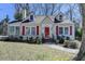 Charming single-story home with red shutters, dormer windows, and a well-manicured front yard at 2953 Hardman Ne Ct, Atlanta, GA 30305