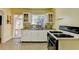 Quaint kitchen features white cabinets and stainless steel sink at 2953 Hardman Ne Ct, Atlanta, GA 30305