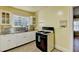 Functional kitchen features stainless steel sink and black gas range at 2953 Hardman Ne Ct, Atlanta, GA 30305