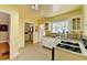 Bright kitchen features stainless steel counters, white cabinets, and a vintage stove at 2953 Hardman Ne Ct, Atlanta, GA 30305