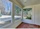 This Screened Porch features multiple windows and a red tiled floor at 2953 Hardman Ne Ct, Atlanta, GA 30305