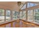 Sunroom boasts multiple windows, lots of natural light and hardwood floors at 2953 Hardman Ne Ct, Atlanta, GA 30305