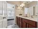 Double sink bathroom with updated countertops and cabinets offering natural light and space at 4727 Tiger Blvd, Duluth, GA 30096