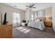 Comfortable bedroom featuring a queen bed, natural light, and a cozy seating area at 4727 Tiger Blvd, Duluth, GA 30096