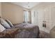 Cozy bedroom featuring a queen bed, neutral walls, and ample closet space perfect for a relaxing retreat at 4727 Tiger Blvd, Duluth, GA 30096