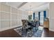 Beautiful dining room features hardwood floors, modern lighting, wainscoting and large windows at 4727 Tiger Blvd, Duluth, GA 30096