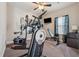 Fully equipped home exercise room with treadmill, elliptical, and bench, perfect for staying active at 4727 Tiger Blvd, Duluth, GA 30096