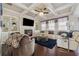 Inviting living room boasts a fireplace, built-in shelving, coffered ceiling, and comfortable seating at 4727 Tiger Blvd, Duluth, GA 30096