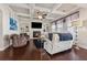 Elegant living room featuring a fireplace, built-in shelving, coffered ceiling, and comfortable seating at 4727 Tiger Blvd, Duluth, GA 30096