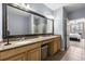 Bright bathroom features double sinks, granite countertops, and a large framed mirror reflecting the interior at 4805 W Village Se Way # 2108, Smyrna, GA 30080