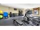 Home gym featuring modern exercise equipment and natural light, with a door leading to the pool at 4805 W Village Se Way # 2108, Smyrna, GA 30080