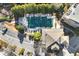 Aerial view of a community pool surrounded by mature trees and lounge chairs for relaxing at 4805 W Village Se Way # 2108, Smyrna, GA 30080